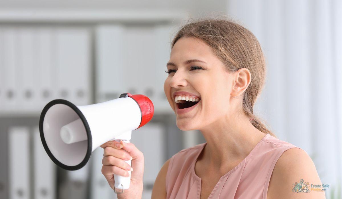 Woman promoting an estate sale announcement with a megaphone
