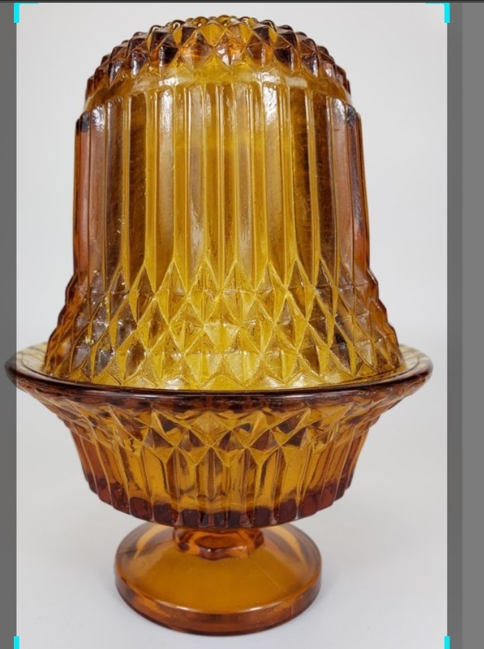 A real antique Clarke's Patent fairy lamp — photograph from Wikimedia Commons showing the classic pyramid shape and marked base