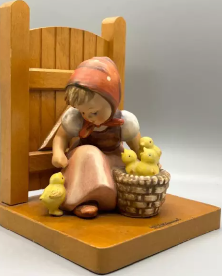 A single hand-painted M.I. Hummel porcelain figurine of a child, the style Goebel produced from 1935 onward