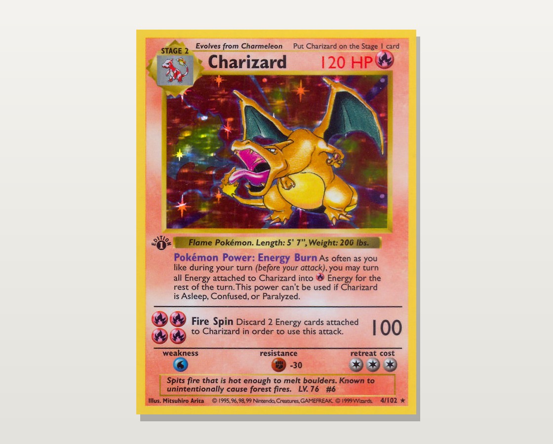 The 1999 Base Set 1st Edition holographic Charizard (#4), showing the rainbow foil across the picture box and the "Edition 1" stamp on the lower left