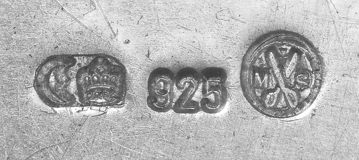A German imperial silver hallmark: crescent moon and crown, the numeric standard "925," and a maker's monogram on the right.