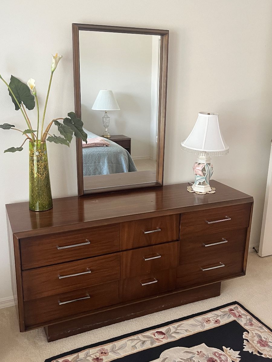 Mid-century modern walnut dresser with mirror at the Tarpon Springs estate sale